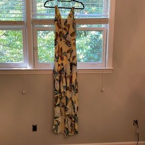 Yellow, strappy floral dress.